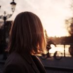 selective focus photography of woman wearing grey notched lapel suit jacket